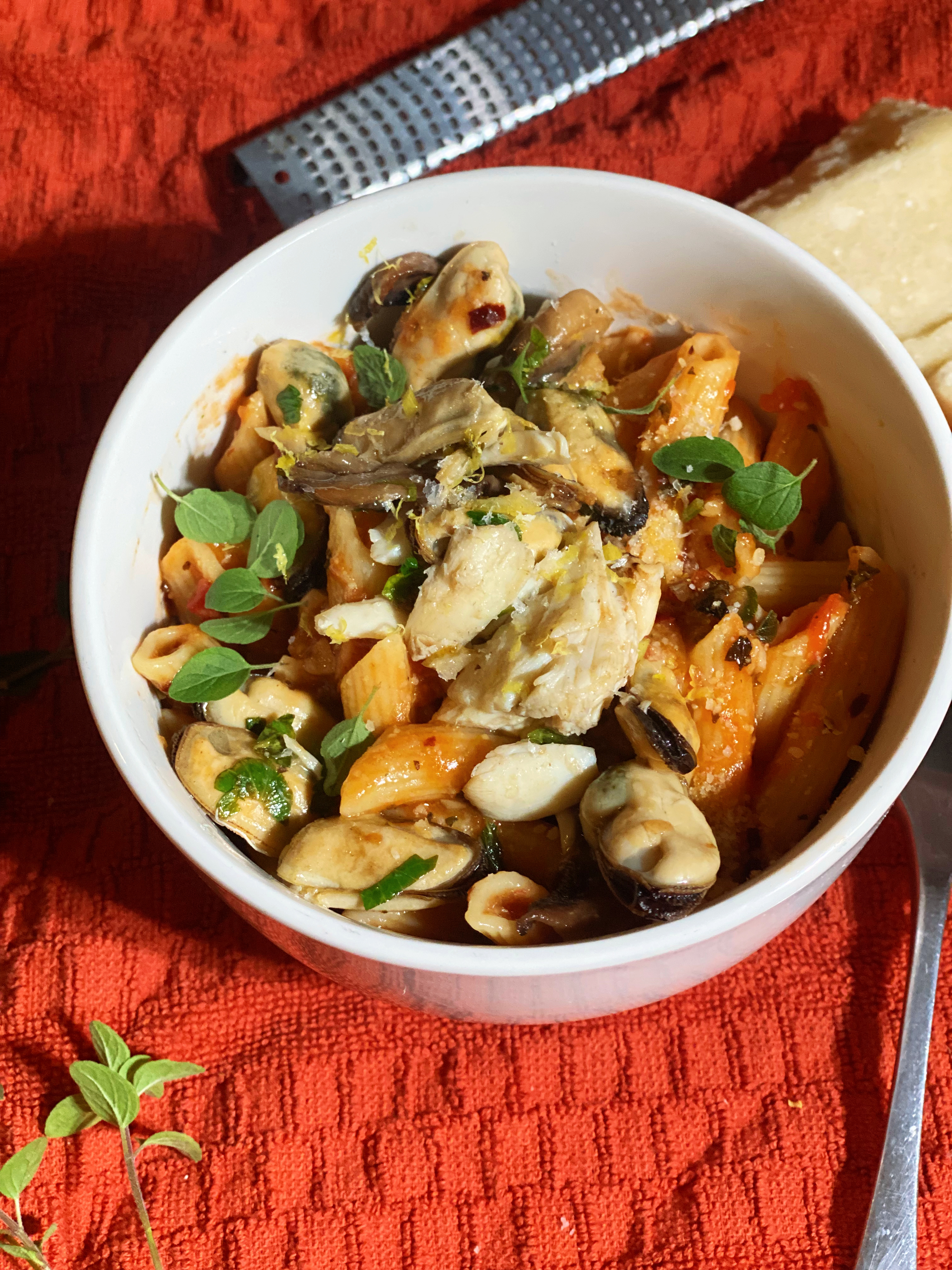 Mussels and Crab over Spicy Penne Pasta