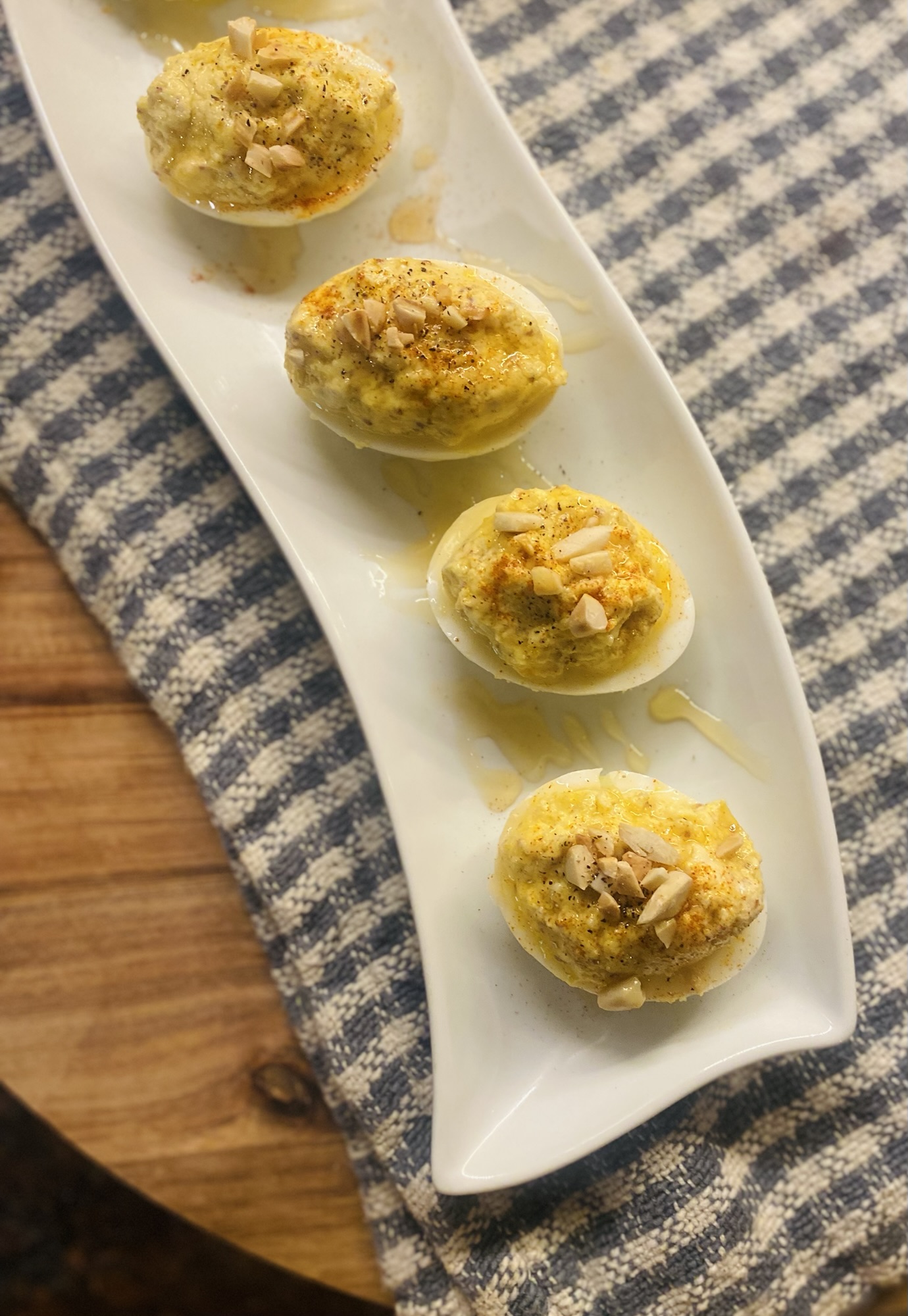 Goat Cheese Deviled Eggs w/ Almonds & Honey